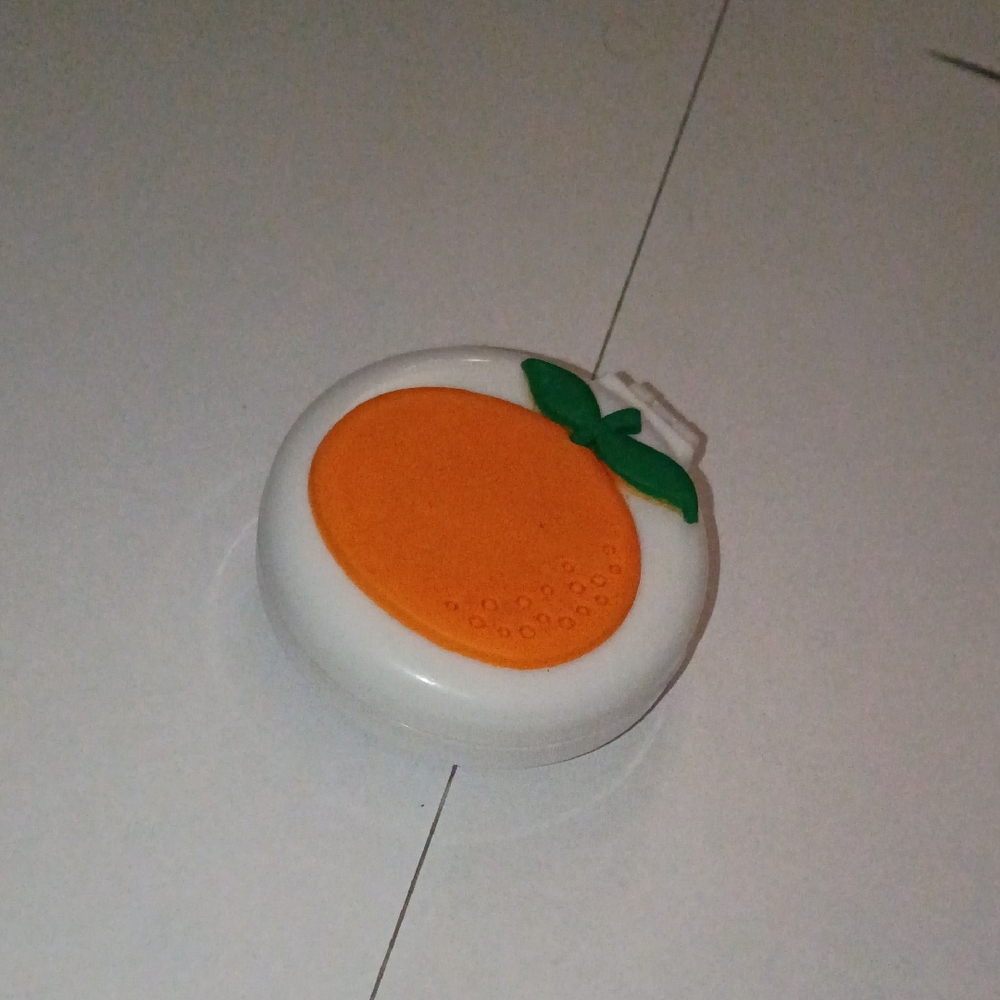 Comb with Mirror With Orange Fruit Decoration.